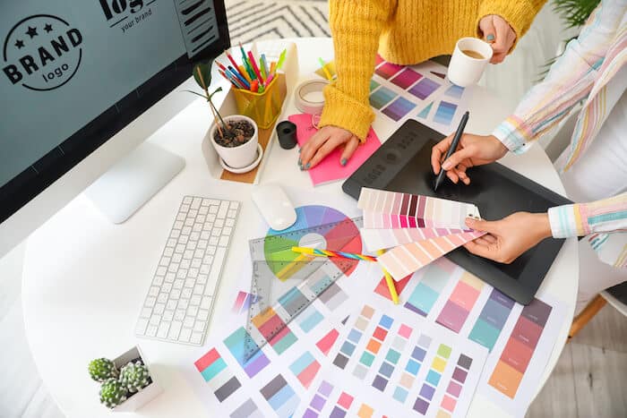 Designers picking colors from color swatches