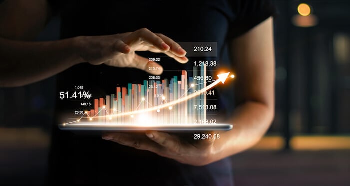 Hologram of a bar chart coming out of a tablet