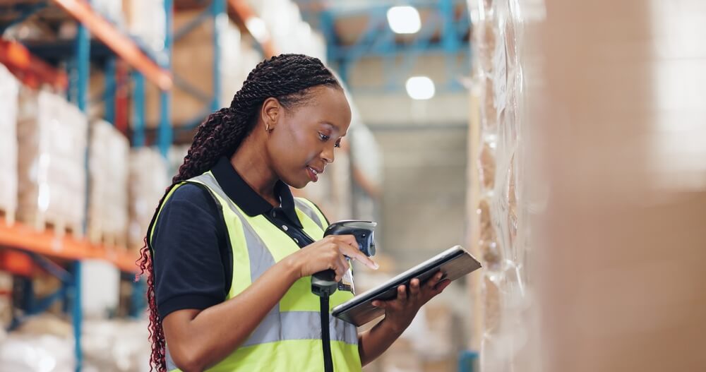 A woman checking the factory for supply chain organization.